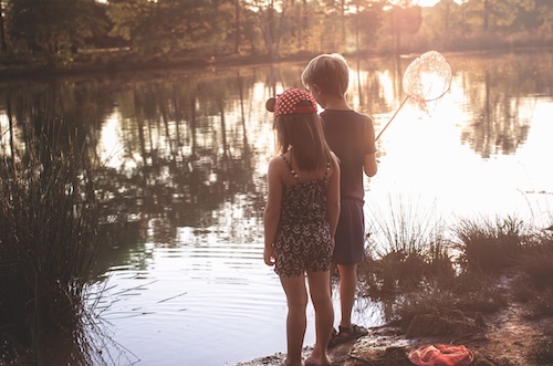 Kids Exploring a Fishing Pond